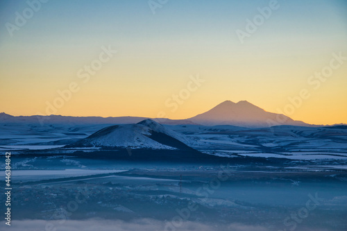 Winter landscape of the Elbrus Mount at sunset
