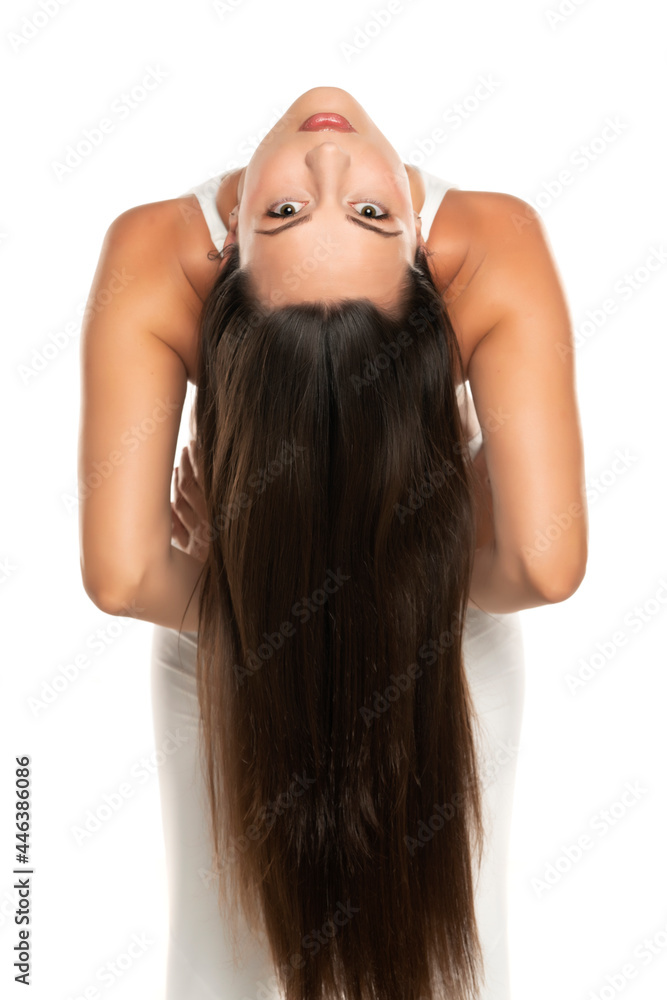 inverted portrait of a young woman with long straight hair inverted portrait of a young woman with long straight hair