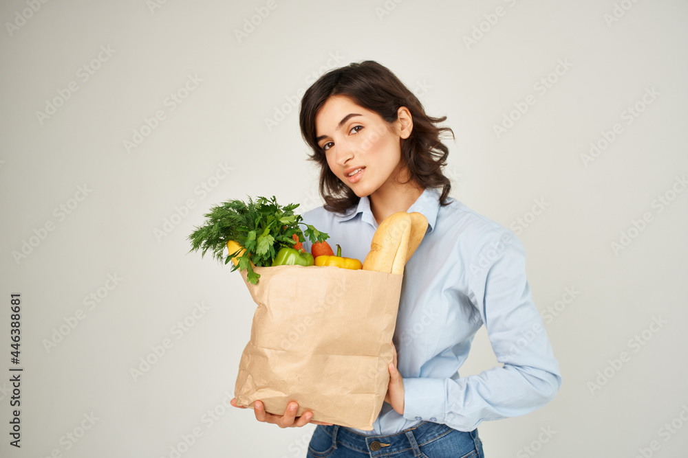 pretty brunette with package of organic food vegetables health pretty brunette with package of organic food vegetables health