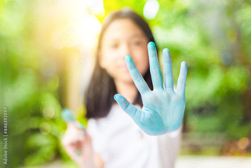 Funny child girl shows hands dirty with paint, Cheerful little cute girl playing and learning with coloring the colors Funny child girl shows hands dirty with paint, Cheerful little cute girl playing and learning with coloring the colors