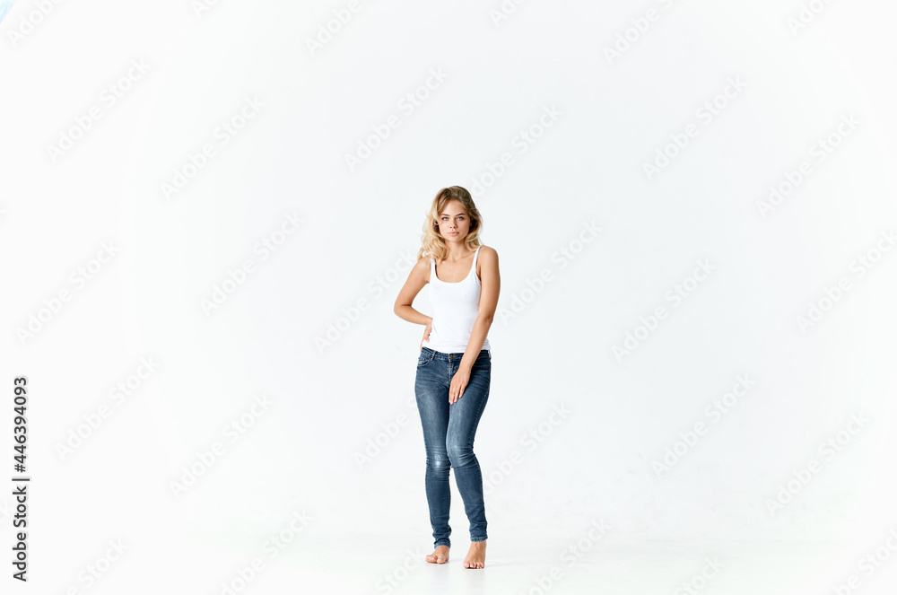 cheerful woman woman in jeans barefoot dancing on the floor cheerful woman woman in jeans barefoot dancing on the floor