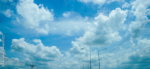 overcrow clouds on blue sky with electricity post on rainning day photo