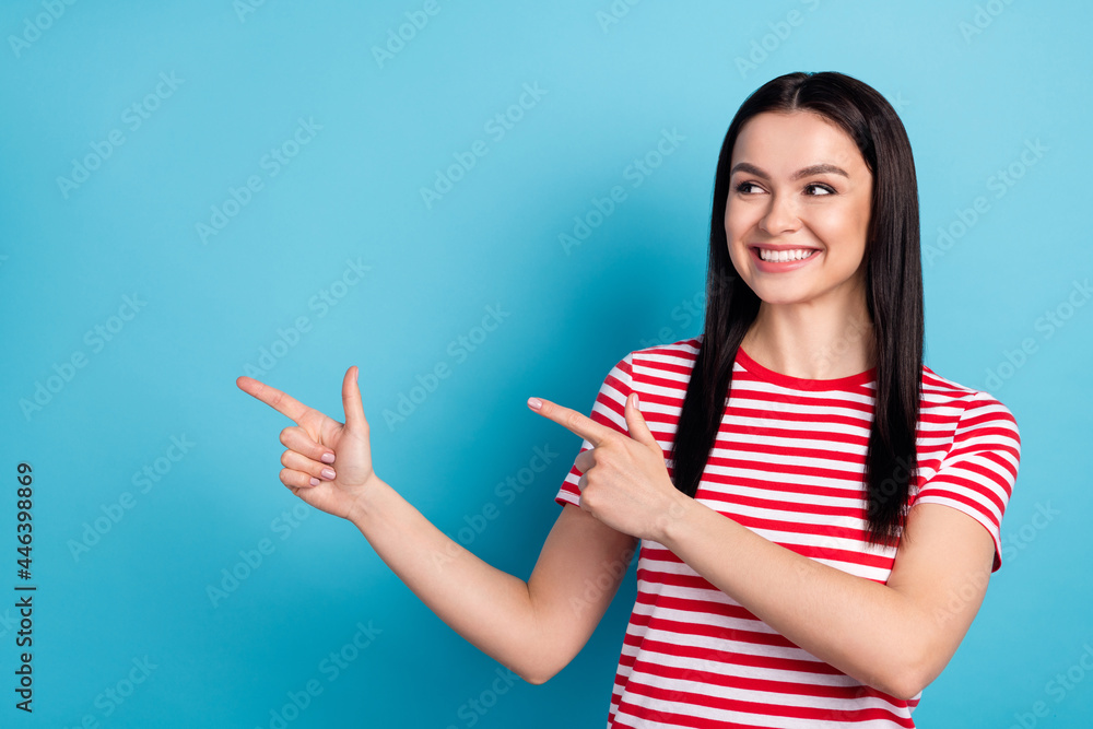 Photo of young cheerful beautiful sweet woman look copyspace advertisement isolated on blue color background Photo of young cheerful beautiful sweet woman look copyspace advertisement isolated on blue color background