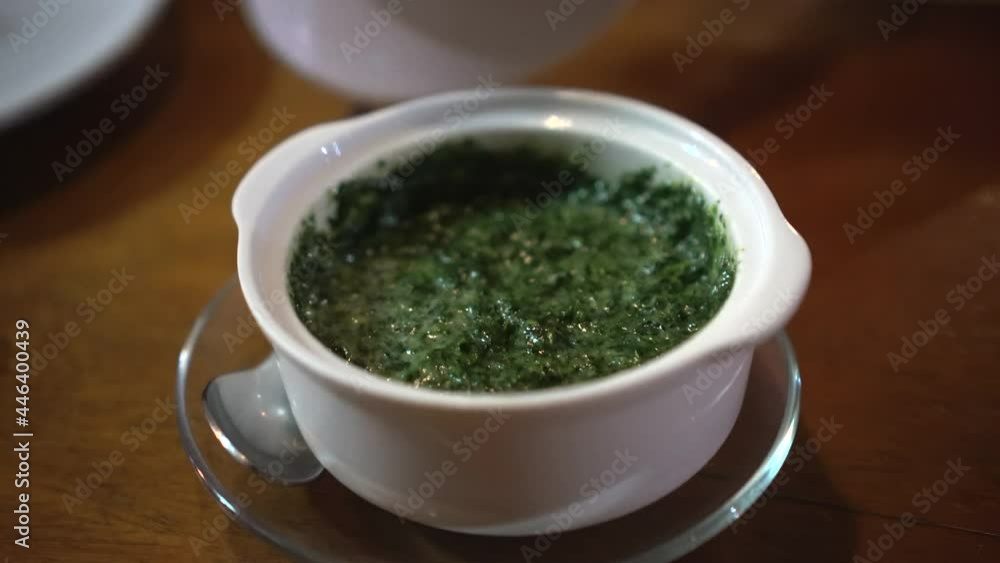 Open baked spinach chesse in small portion white ceramic Open baked spinach chesse in small portion white ceramic