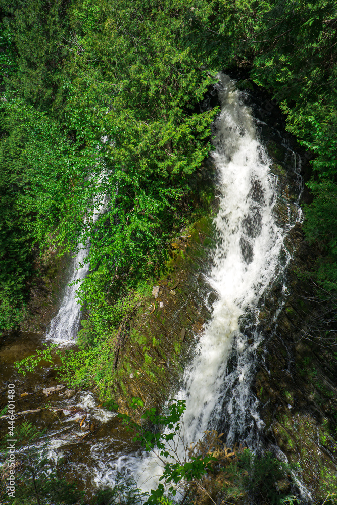 The Chaud waterfall in the Canyon des Portes de l'Enfer nature park (Hell's gate canyon) located in Bas Saint Laurent region of Quebec (Canada) The Chaud waterfall in the Canyon des Portes de l'Enfer nature park (Hell's gate canyon) located in Bas Saint Laurent region of Quebec (Canada)