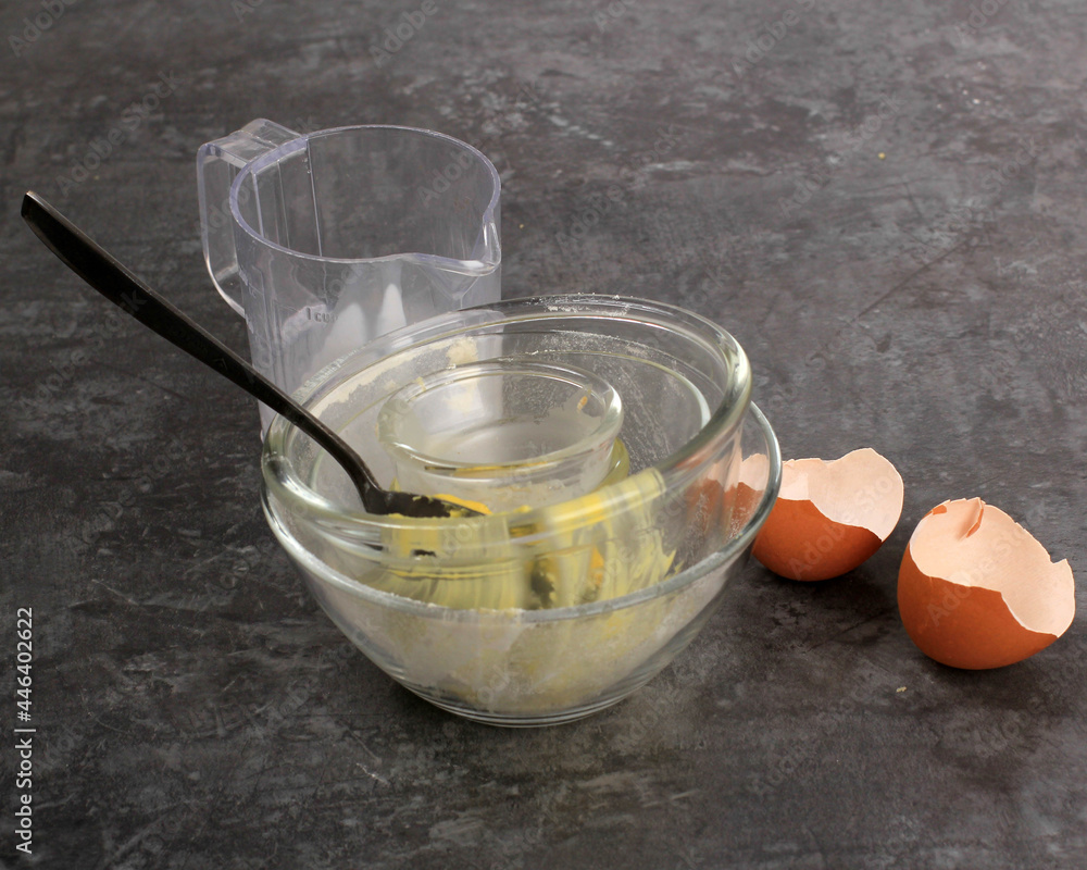 Aftermath Baking Preparation, Dirty Bowl and Egg Shell in the Kitchen, Ready to Wash Aftermath Baking Preparation, Dirty Bowl and Egg Shell in the Kitchen, Ready to Wash