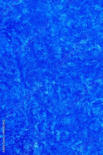Blue abstract textured background surface with grungy paint style effect. Decorative backdrop with space for text for artistic projects, decoration, cover, etc.