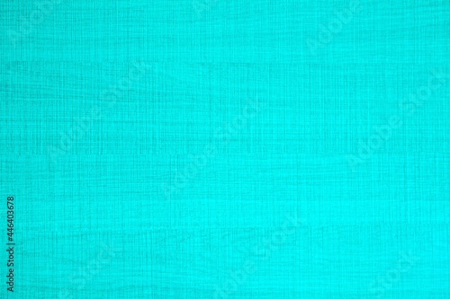 Turquoise background with textured surface and grungy background. Blank horizontal image for backdrop, light color poster, text, simple decoration, paper, etc.