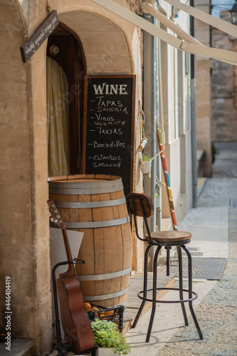 Entrance of a Spanish Tapas Bar With Barrel and Guitar