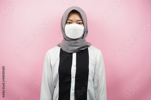 Muslim women wearing white masks, anti corona virus movement, anti covid-19 movement, health movement using masks, isolated on pink background