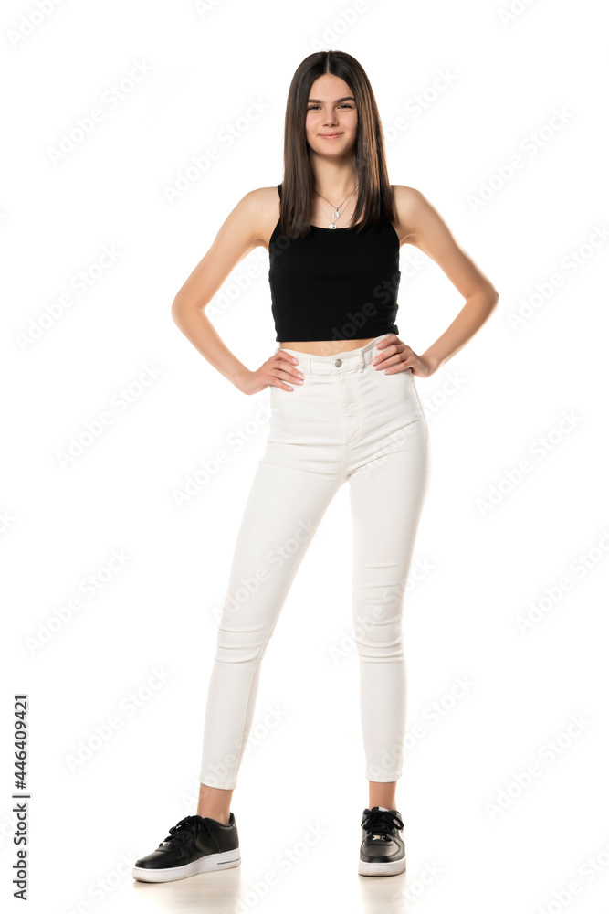 a teenage girl in white jeans and a black shirt a teenage girl in white jeans and a black shirt