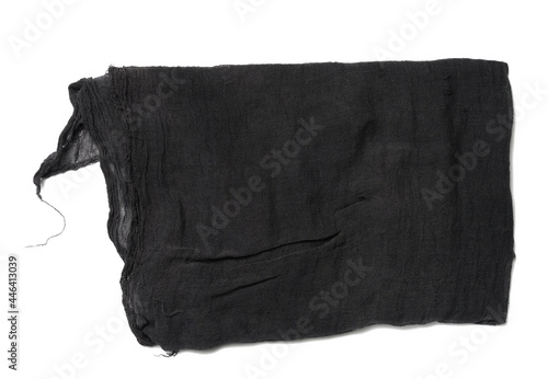 folded black gauze kitchen napkin on white background, top view