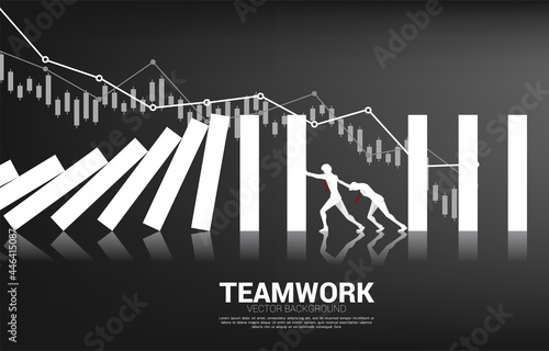 Silhouette of businessman pushing for stop falling of domino. business concept of try to stop the domino effect