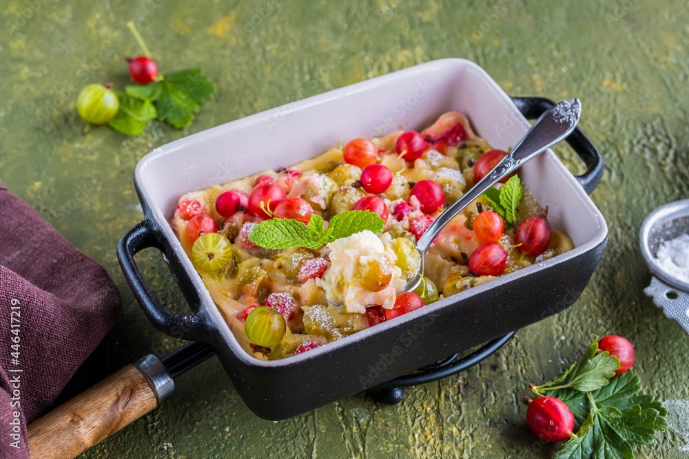 Clafoutis with gooseberries, a French dessert made from baked pancake