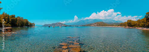 Panoramic view of Phaselis Beach and Bey Mountains on the background. Tekirova Antalya Turkey. South harbor of Phaselis Ancient City in Antalya. Tourism in Turkey.