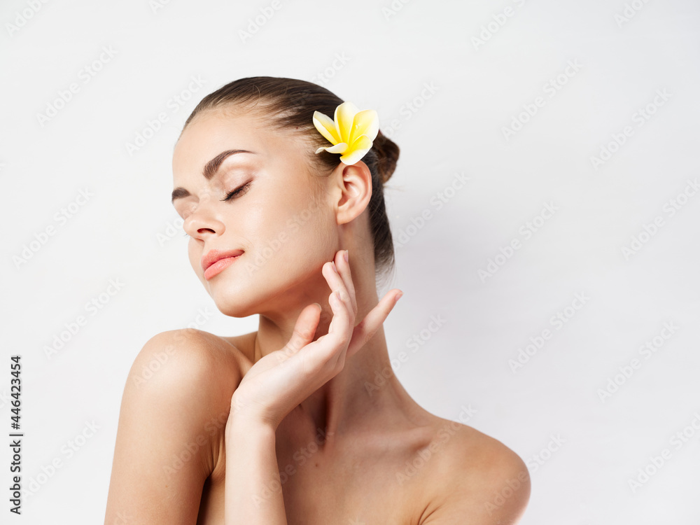 pretty woman with closed eyes naked shoulders flower in hair charm pretty woman with closed eyes naked shoulders flower in hair charm