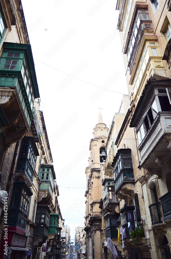 MALTA, VALETTA: Scenic cityscape view of the streets with old buildings 