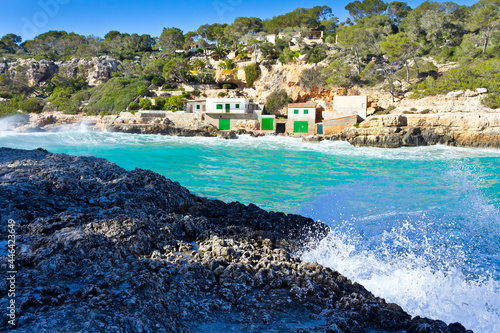 On the rocks of popular Cala Llombards, balearic island of Majorca or Mallorca, in winter. View in direction of Cala Santanyi.