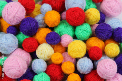 Colorful background of multi-colored yarn for knitting,crocheting.Many balls of yarn of all colors.The concept of handmade work,a favorite hobby, selling yarn.Top view.Flatlаy.Copyspace.