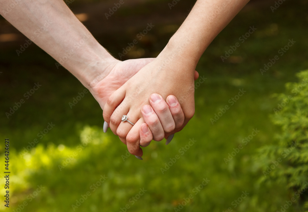 man and woman hold hands. hands closeup man and woman hold hands. hands closeup
