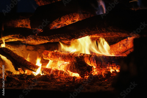 Wood in a fire with an open fire and red coals