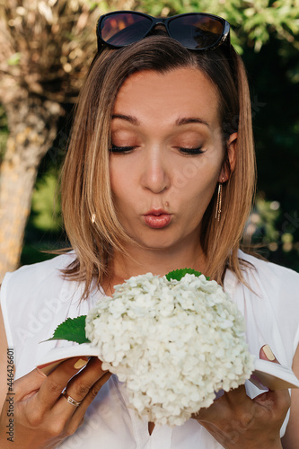 A beautiful woman in a summer park.
