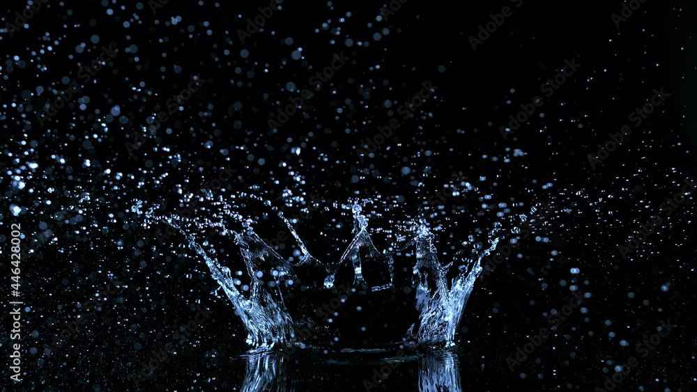 Freeze motion of water splash on black background.