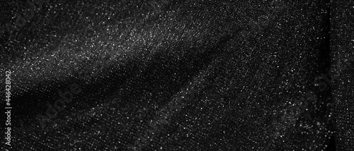 Glittering fashion black background with twinkling grainy texture