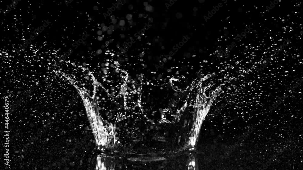 Super slow motion of splashing water crown shape on black background. Filmed on high speed cinema camera, 1000fps. Super slow motion of splashing water crown shape on black background. Filmed on high speed cinema camera, 1000fps.