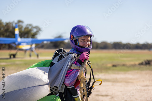 female skydiver returning to base after a successful jump
