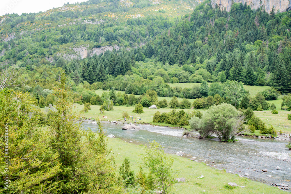 Meadows, lakes, rivers, woods  and mountains  in the Aragonese Pyrenees bordering the French border