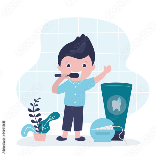 Little boy with toothbrush brushes teeth. Happy teenager in bathroom cleans teeth. Tools for personal hygiene