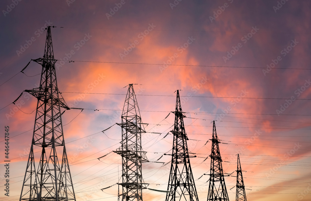 High voltage power lines at sunset. Electricity is dangerous