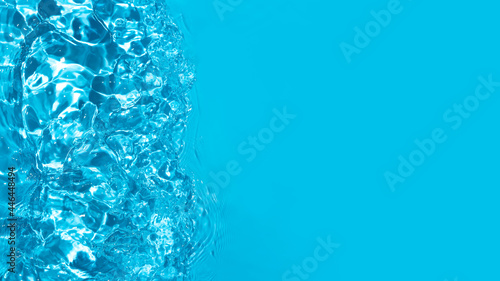 Top view of blue water Water waves in sunlight with copy space. Abstract surface blue water reflected with sunlight for background.