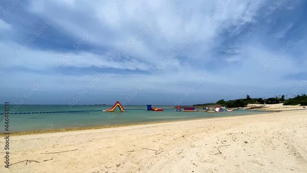 YOMITANSON, OKINAWA, JAPAN - JUNE 2021 : View of Zanpa beach (Ocean or sea). Wide view, time lapse shot in daytime. Holiday, vacation and resort concept shot. YOMITANSON, OKINAWA, JAPAN - JUNE 2021 : View of Zanpa beach (Ocean or sea). Wide view, time lapse shot in daytime. Holiday, vacation and resort concept shot.