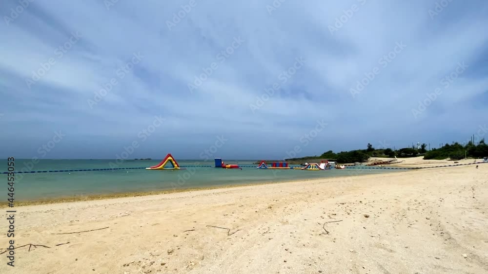 YOMITANSON, OKINAWA, JAPAN - JUNE 2021 : View of Zanpa beach (Ocean or sea). Wide view, time lapse shot in daytime. Holiday, vacation and resort concept shot. YOMITANSON, OKINAWA, JAPAN - JUNE 2021 : View of Zanpa beach (Ocean or sea). Wide view, time lapse shot in daytime. Holiday, vacation and resort concept shot.