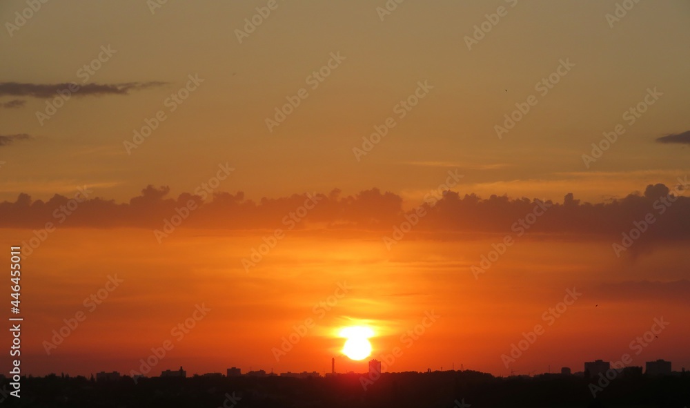 Beautiful orange fiery sunset over the city, natural background