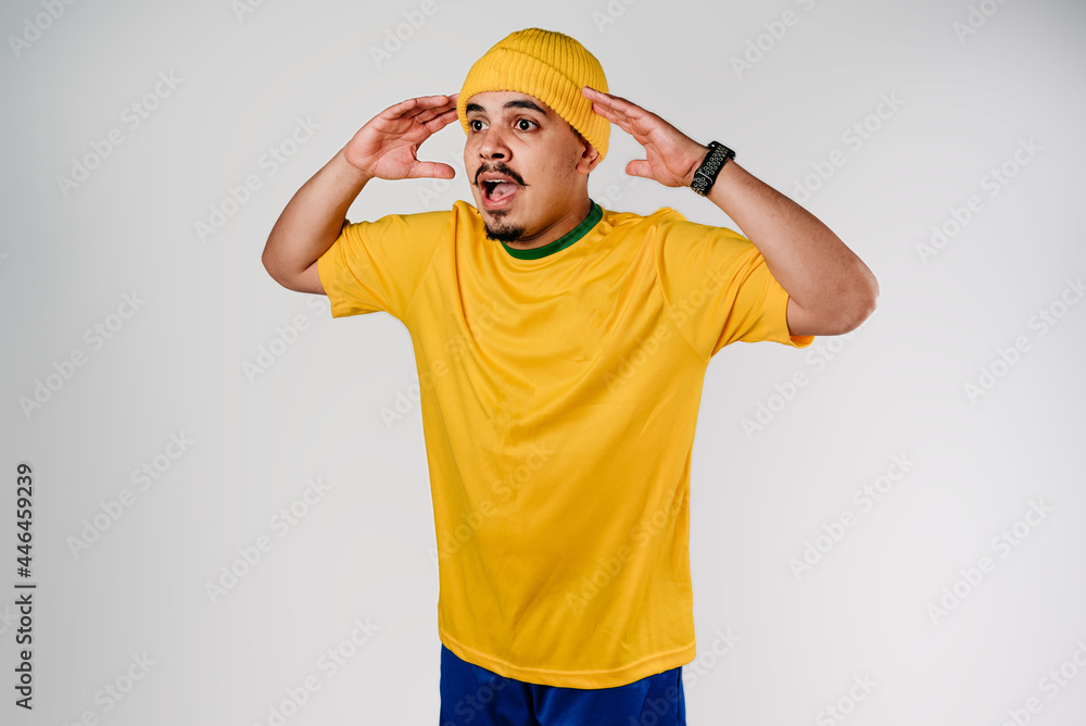 Frightened fan with yellow shirt and yellow cap
