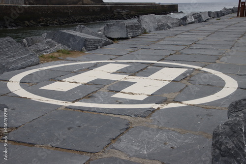 Sign for helicopters by the shore