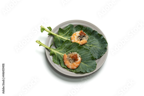 A type of Leaf Wraps and Rice ( Ssambap ) eaten with boiled shrimp, rice and soybean paste in vegetable leaves photo