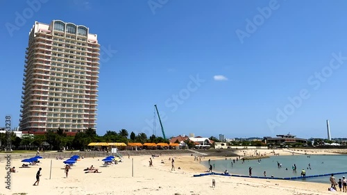 CHATAN-CHO, OKINAWA, JAPAN - JUNE 2021 : View of Chatan sunset beach (Ocean or sea). Wide view, time lapse shot in daytime. Holiday, vacation and resort concept shot. photo