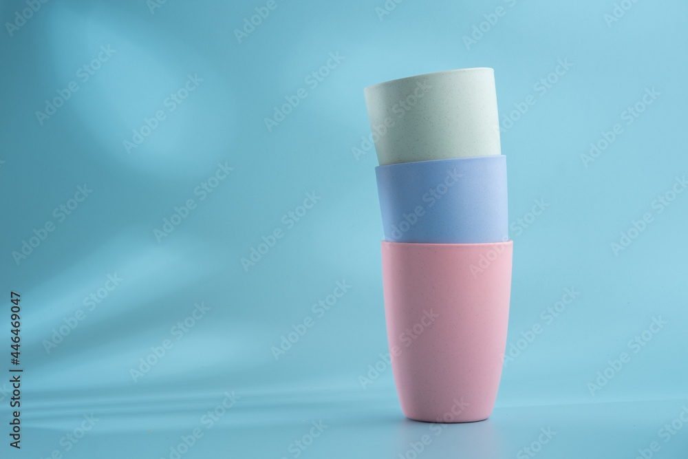 Colorful plastic cups on a white background Colorful plastic cups on a white background