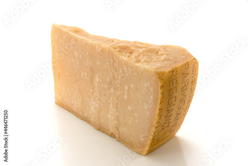 Piece of Parmesan cheese, original Italian cheese isolated on white, copy space photo