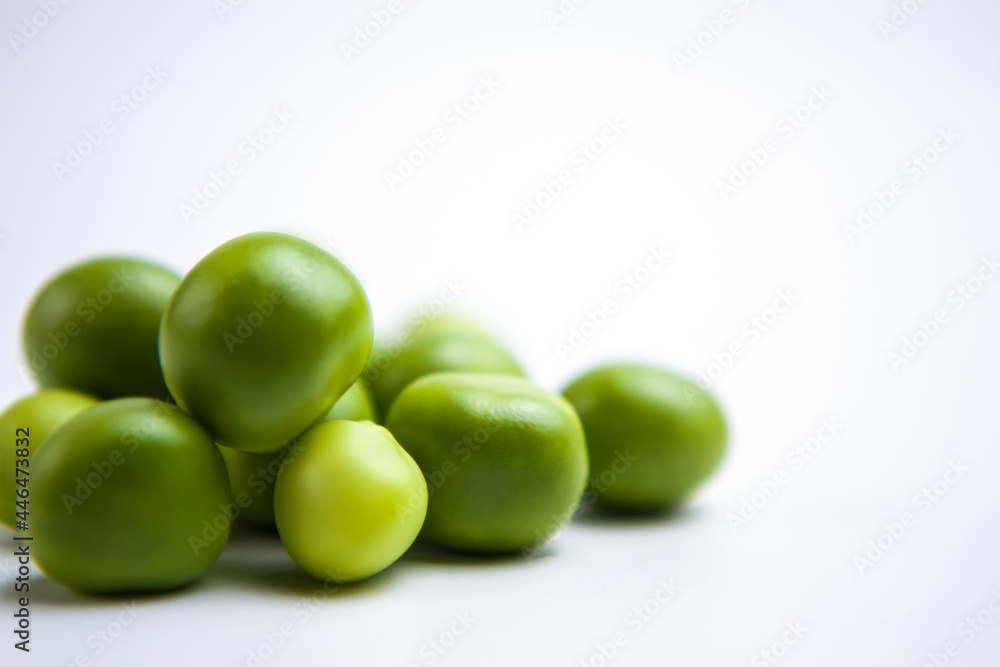 Falling green peas isolated on white background with clipping path Falling green peas isolated on white background with clipping path