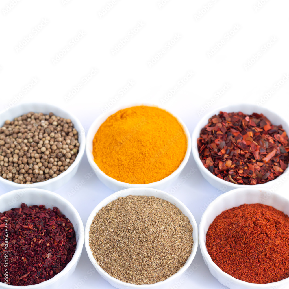 Different organic spices in bowl isolated on white Different organic spices in bowl isolated on white