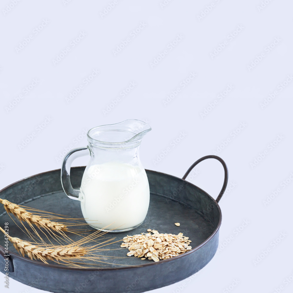 Vegan oat milk non dairy alternative milk in jug Vegan oat milk non dairy alternative milk in jug