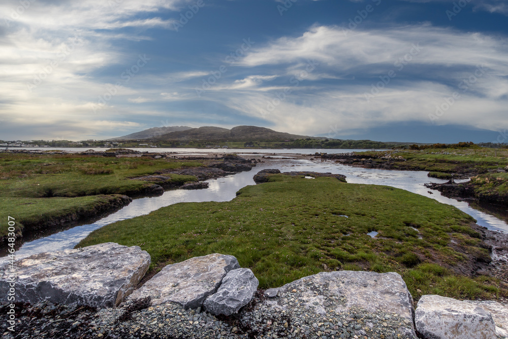 seascape. Inishnee coastline with Roundstone town in the background seascape. Inishnee coastline with Roundstone town in the background