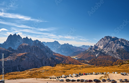 Stunning alpine Landscape at sautumn sunny day. Alpine meadow and road, mountains on background. amazing nature Landscape. Dolomites Alps. Italy. photo