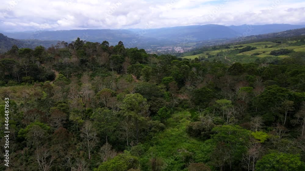 Beautiful aerial view of the Aquiares town and its iconic yellow church in Cartago Costa Rica Beautiful aerial view of the Aquiares town and its iconic yellow church in Cartago Costa Rica