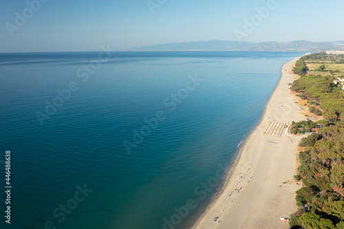 Aerial view of beautiful sea and beach at sunny day, seascape and hill mountain on backgrond, Simeri Mare, Calabria, Southern Italy © robertobinetti70